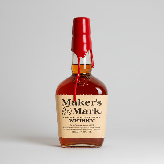Maker's Mark Whisky bottle with a red cap on a white background