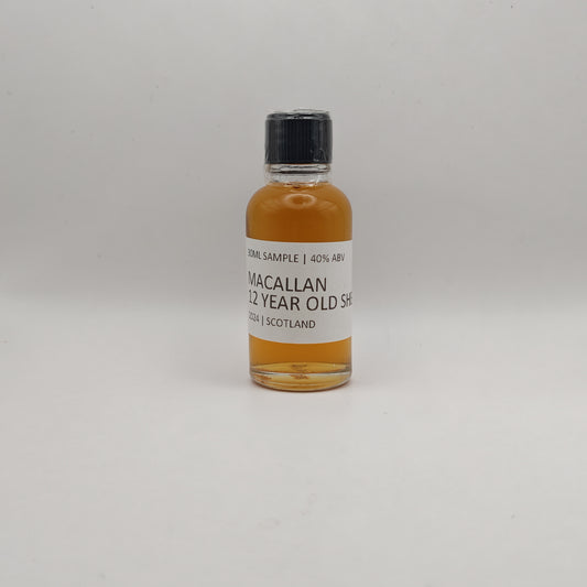 Small bottle of Macallan 12 Year Old Sherry whisky sample on a white background