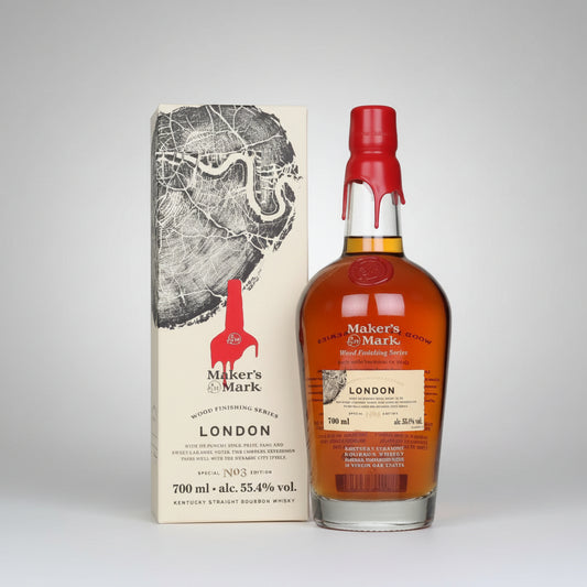Maker's Mark bourbon bottle and packaging on a white background