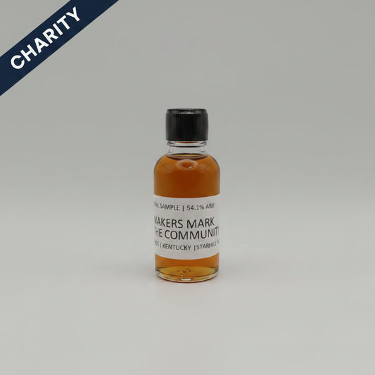 Small bottle of Maker's Mark Community bourbon on a gray background