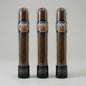 Three brown cigars in clear cylindrical tubes with black caps and circular Los Martinez Silver Selection labels, arranged side by side on a light gray background.