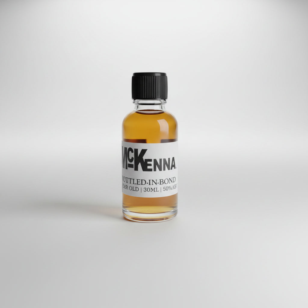 Small bottle of McKenna whiskey on a bar counter with a blurred bar background