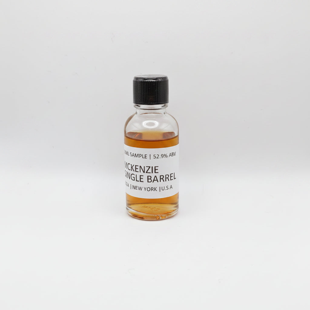 Small bottle of McKenzie Single Barrel on a light gray background