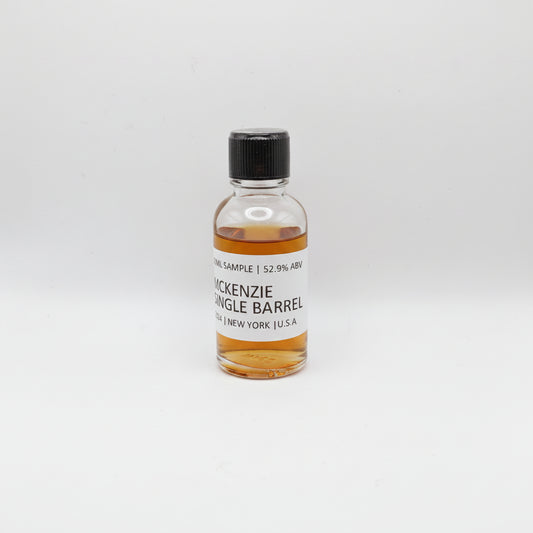 Small bottle of McKenzie Single Barrel on a light gray background