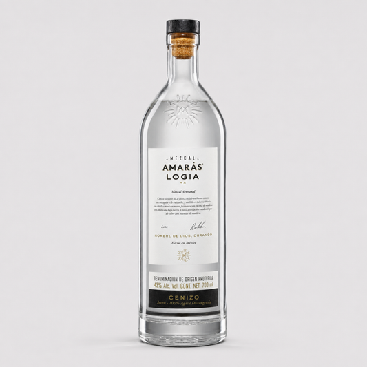 A clear glass bottle of Vittel Amarás Logía gin with a white label and black cap, sealed with a cork, on a light gray background.