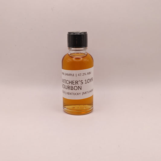 Small bottle of Michter's 10 Year Bourbon on a light beige background