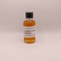 Small bottle of Michter's 10 Year Bourbon on a light beige background
