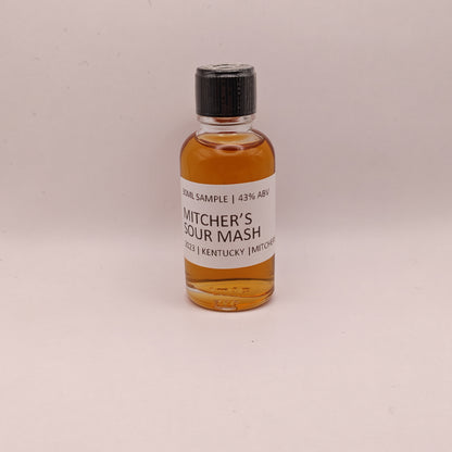 Small bottle of Mitcher's Sour Mash whiskey on a light background
