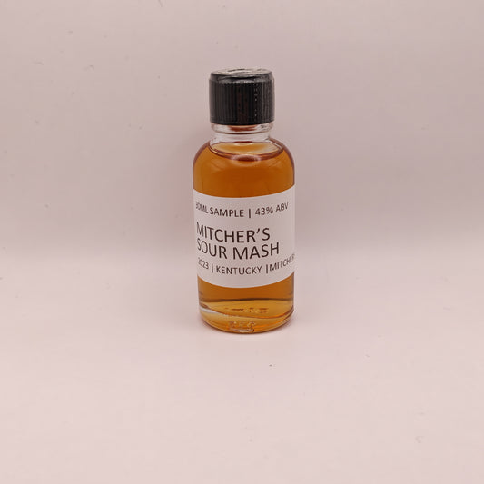 Small bottle of Mitcher's Sour Mash whiskey on a light background