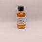 Small bottle of Mitcher's Sour Mash whiskey on a light background