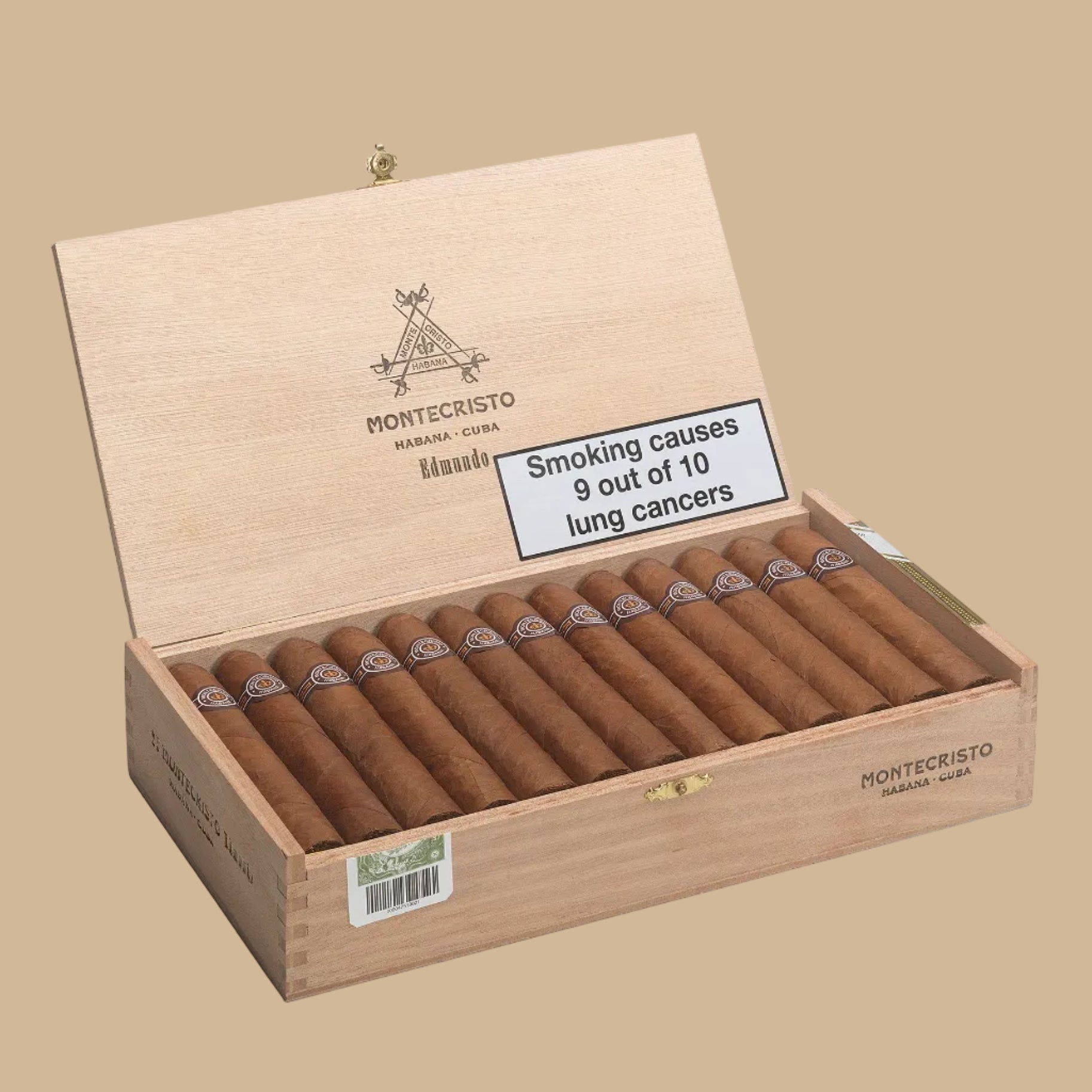 Open wooden box of Montecristo cigars with warning label on a white background