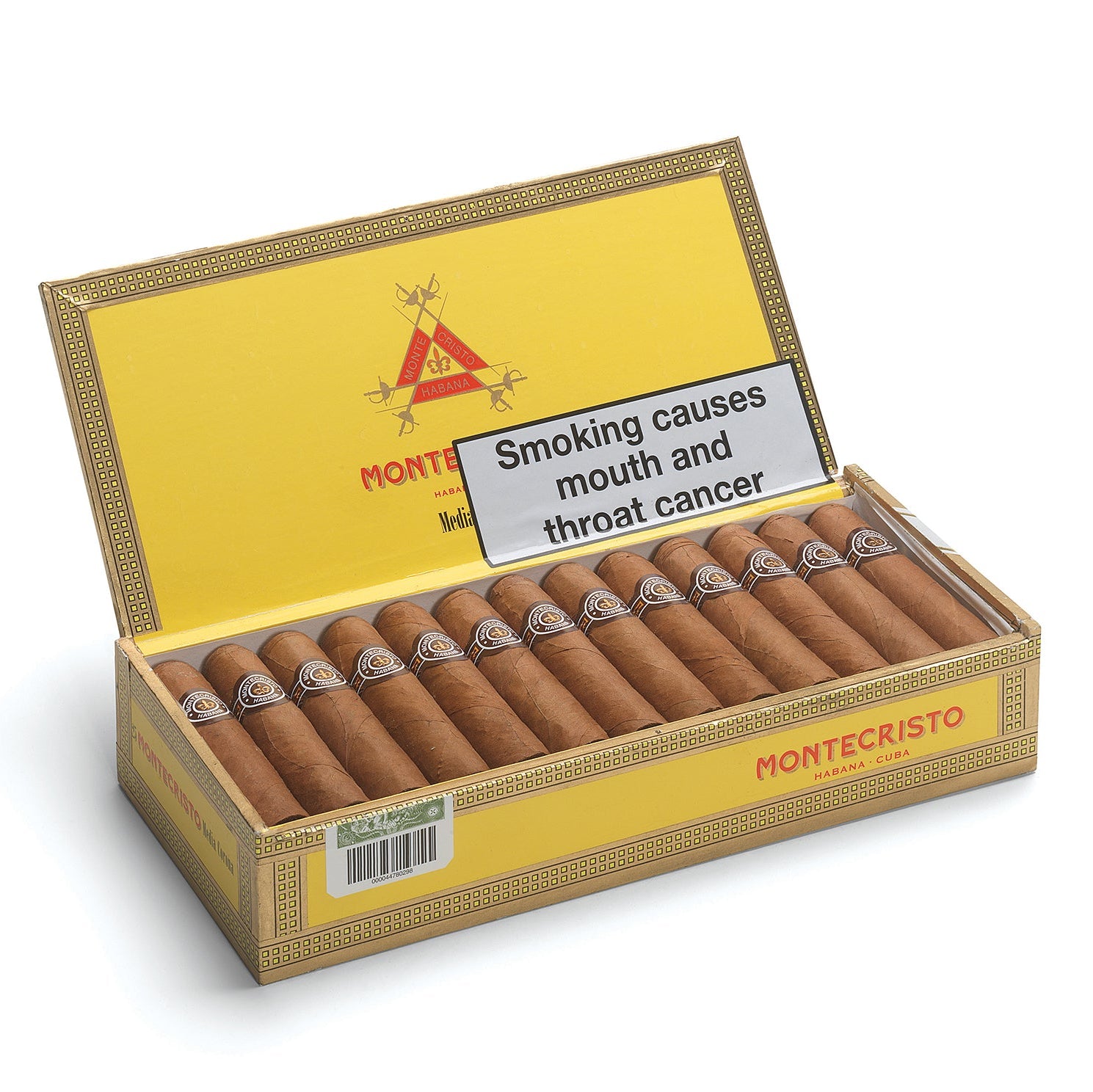 Open box of Montecristo cigars with a health warning label on a white background
