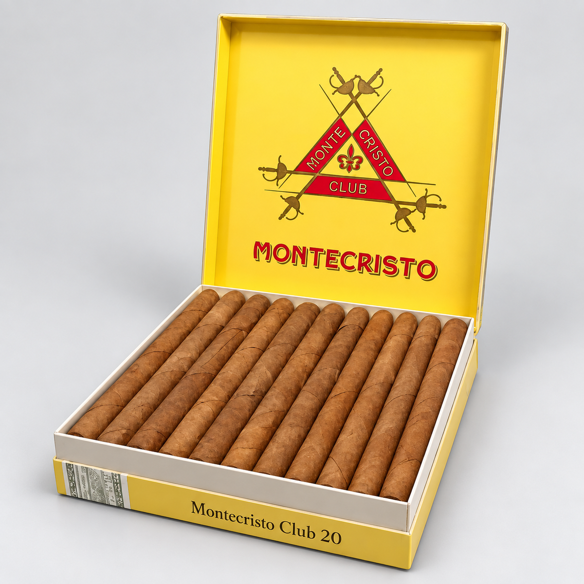 An open Montecristo Club cigar box showing 20 brown cigars inside, photographed on a light gray studio background. The box lid is bright yellow with the Montecristo logo and the text 'Montecristo Club 20' printed on the front.