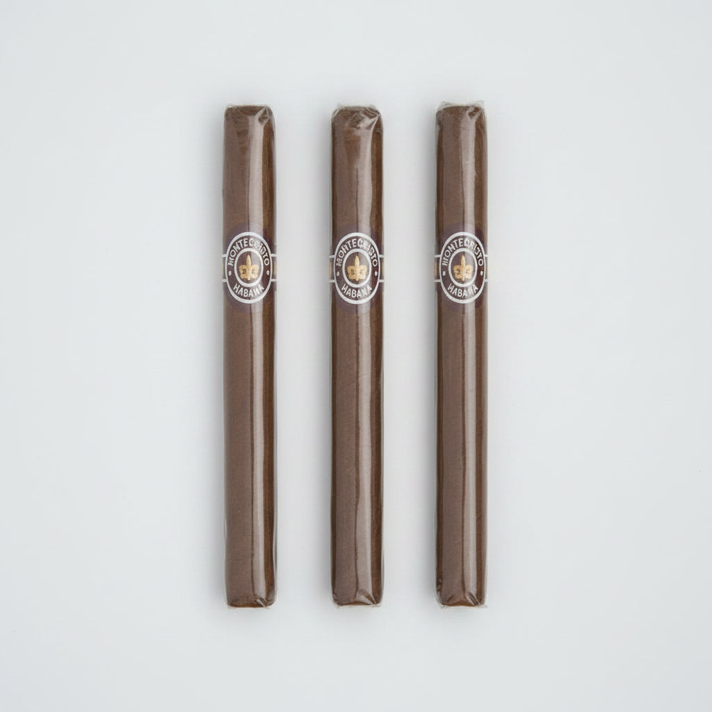 A single Montecristo Haban cigar in its clear plastic wrapper, showing the brown tobacco body and the circular Montecristo logo band.