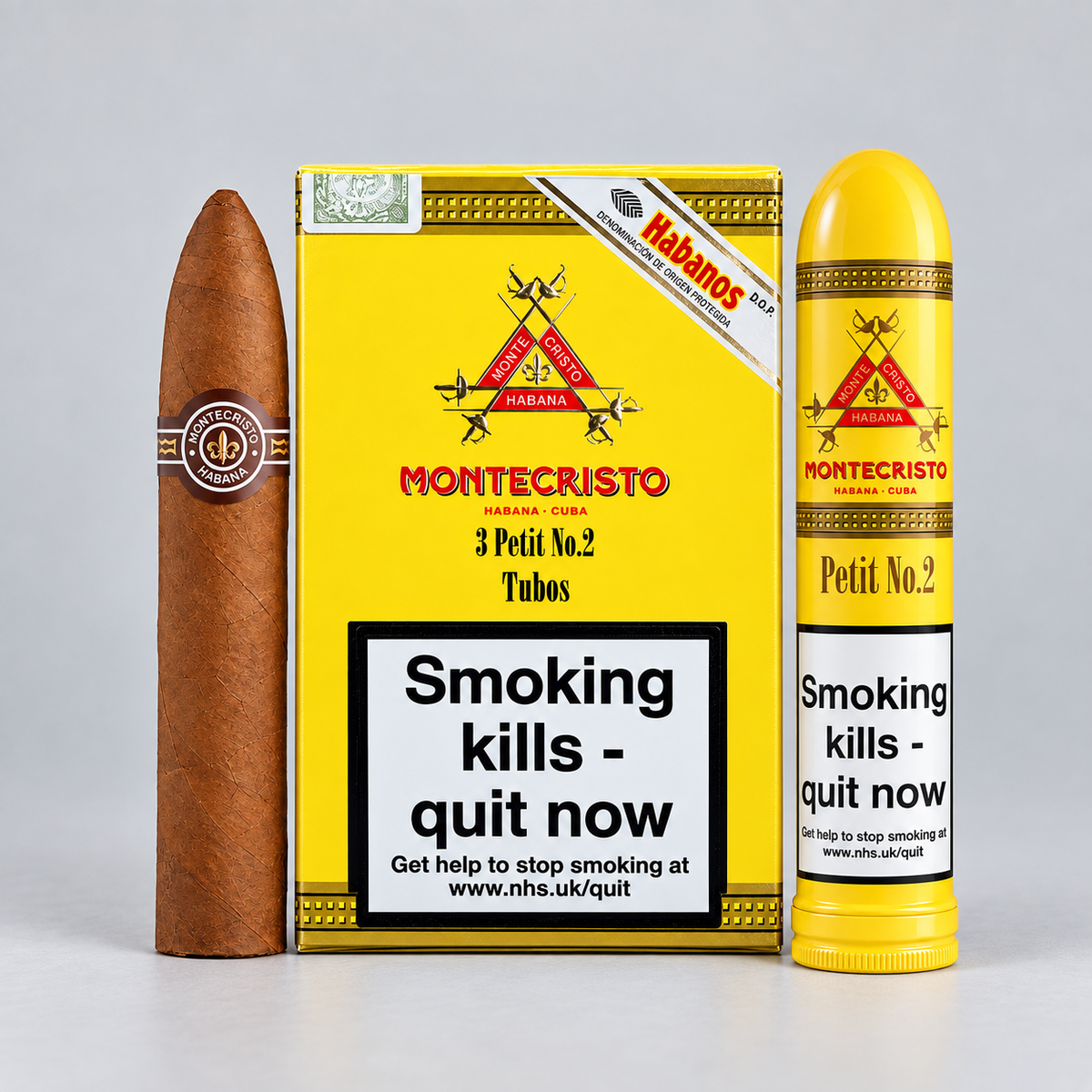 A Montecristo Petit No. 2 cigar and matching yellow packaging are displayed on a light gray studio background.