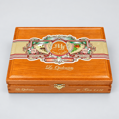 A premium wooden cigar box from La Opulencia, featuring a polished orange-brown wood finish, a decorative beige and red paper band with illustrations of birds and flowers, and gold foil lettering.