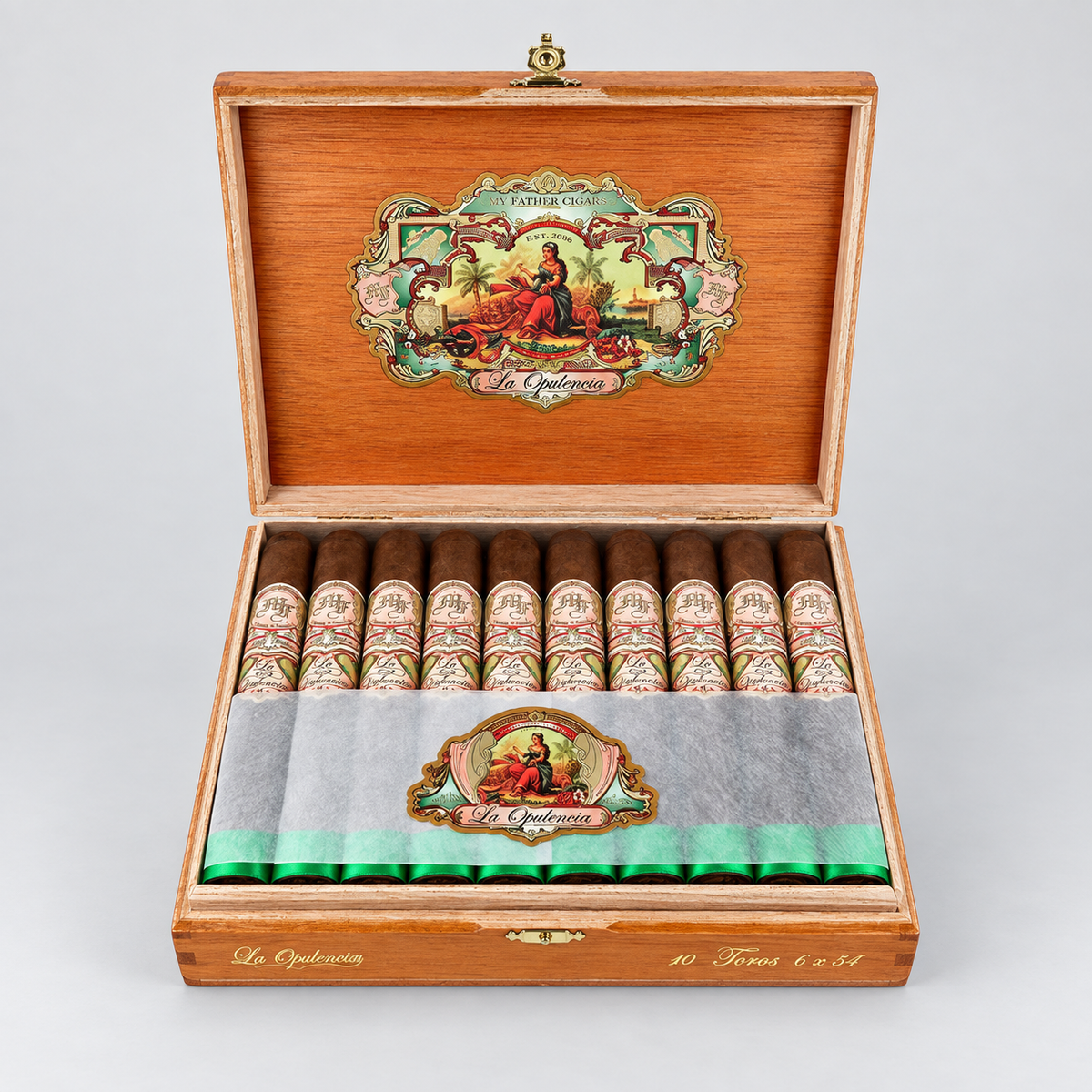 An open wooden cigar box displaying ten cigars inside, with a gray paper band across the front and a decorative interior lid featuring a colorful illustration. The brand name 'El Chaparral' is visible on the packaging.