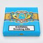 A bright blue cigar box with ornate gold, red, and white decorative artwork across the top and a large white warning label reading 'WARNING: Smoking kills' on the front. The visible brand text includes 'My Father Cigars' and 'Rumiantes'.