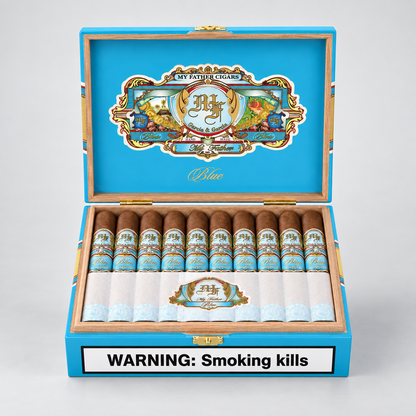 An open blue cigar box displaying multiple cigars inside, with a large decorative crest on the inner lid and a white warning label reading 'WARNING: Smoking kills' on the front. The cigars have brown bodies with blue and gold bands, and the box is set against a light gray background.