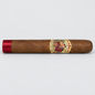 A single brown cigar with a red satin band on one end and a detailed vintage-style label in the center, photographed horizontally against a light gray background.
