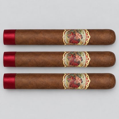 Three brown cigars arranged horizontally on a light gray background, each with a red satin tip and a decorative circular band featuring a portrait.