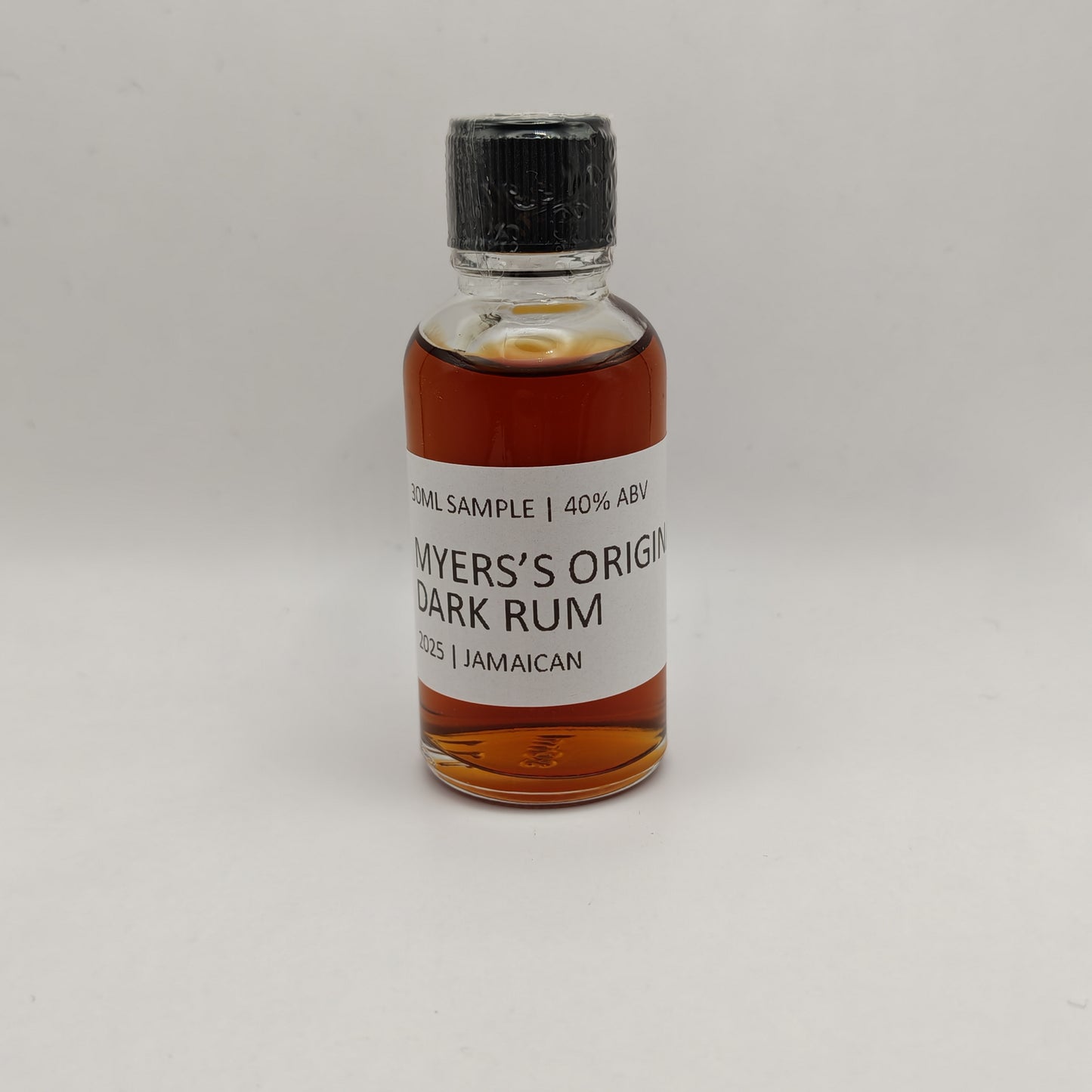 Bottle of Myers's Original Dark Rum on a gray background