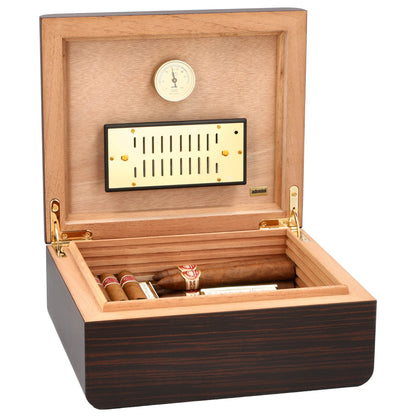 Wooden humidor with cigars and a hygrometer on a white background