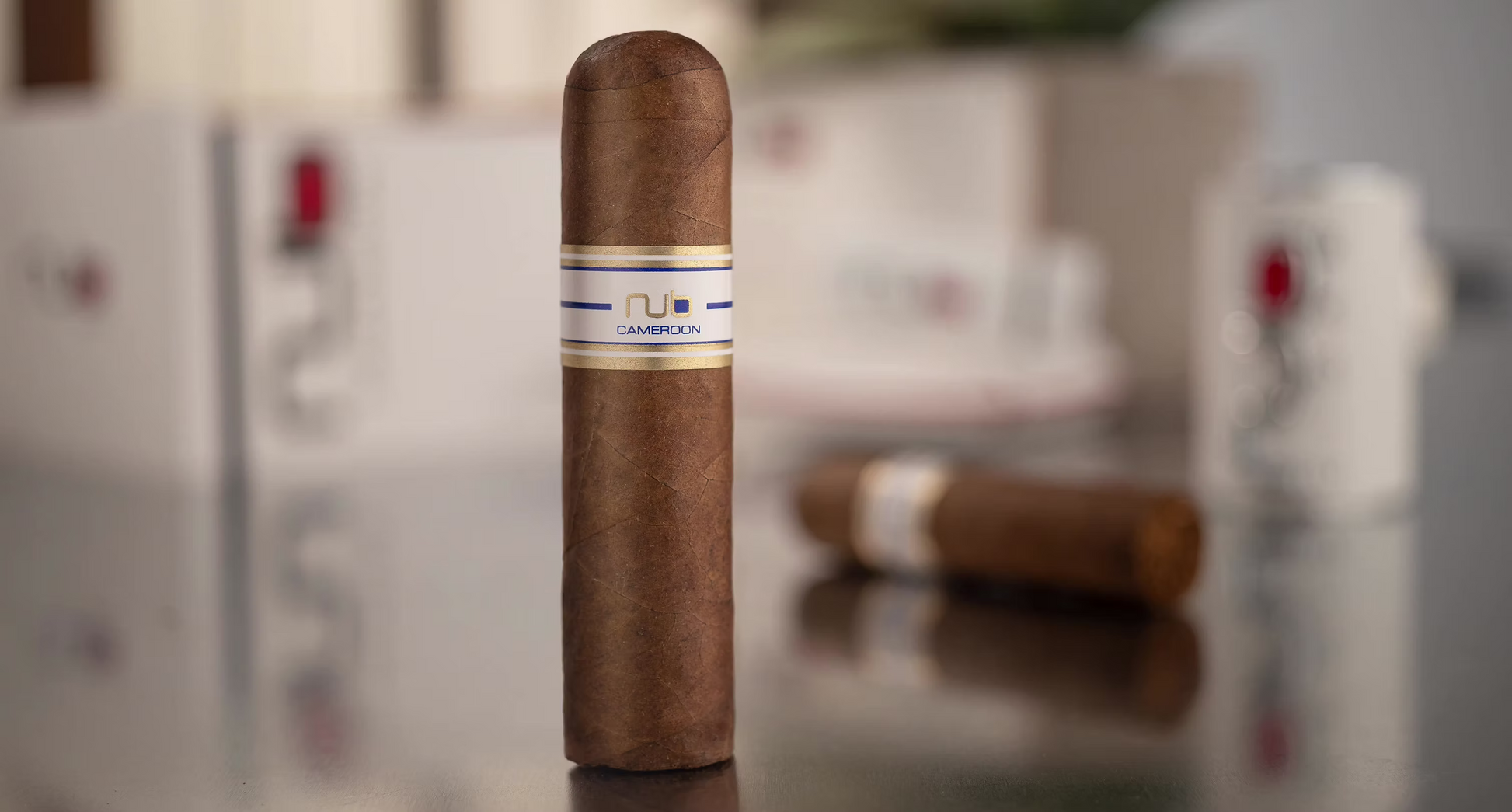 Cigar with a visible NUB brand label on a reflective surface