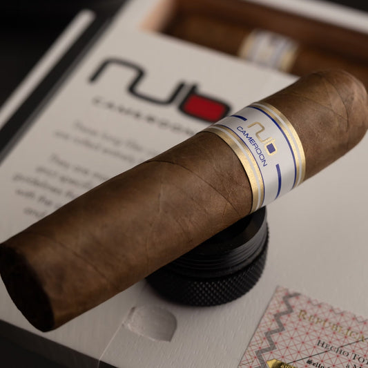 Cigar with a visible NUB brand label on a table