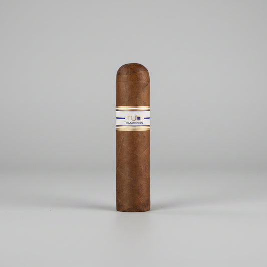 Cigar with a visible brand label on a reflective surface