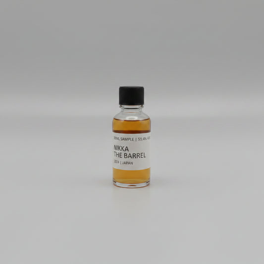 Small bottle of Nikka whisky with a label on a white background