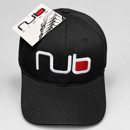A black baseball cap with a white and red embroidered 'nub' logo on the front, featuring a white hangtag with the same logo, photographed on a light gray background.