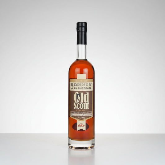 A bottle of Old Scout Straight Bourbon Whiskey with amber liquid, a brown label, and a black cap, shown on a white background with a reflection.