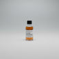 Bottle of Old Rip Van Winkle whiskey on a reflective surface with blurred background
