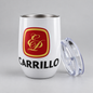 A white insulated stemless tumbler with a clear lid resting beside it, featuring a red and gold monogrammed crest and the name 'CARRILLO' in black text on the front, set against a neutral gray background.