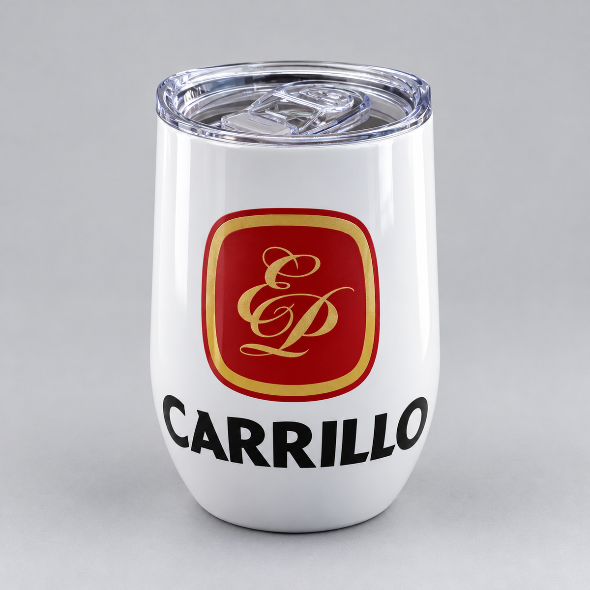A white insulated stemless wine tumbler with a clear lid, featuring a red and gold Carrillo logo and the brand name 'CARRILLO' printed in black below.