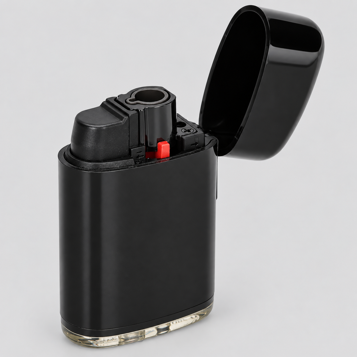 A matte black electronic lighter with its hinged lid open, showing a small red accent button and a clear base, set against a light gray background.