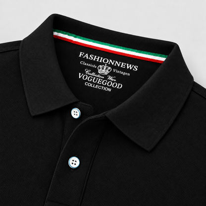 Close-up of a black polo shirt collar with white buttons and a green, white, and red striped inner neck trim. The inside collar is printed with 'FASHIONNEWS' and 'VOGUEGOOD Collection' text.