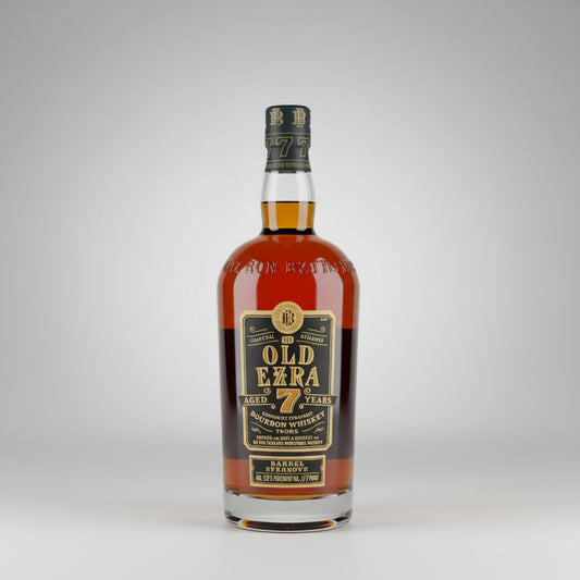 A bottle of Old Ezra 7 Years Bourbon Whiskey standing on a wooden surface against a plain light background.