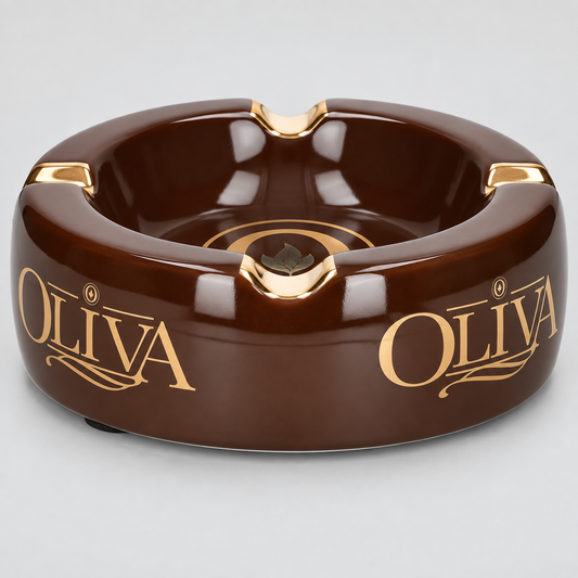 A glossy dark brown ceramic ashtray with gold accents and the brand name 'OLIVA' printed in gold on both sides, shown on a light gray background.