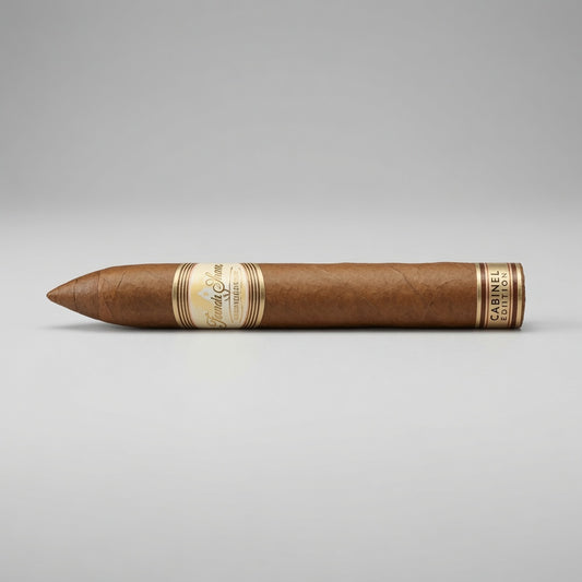 A single brown cigar with gold and cream bands, positioned horizontally on a light gray background.