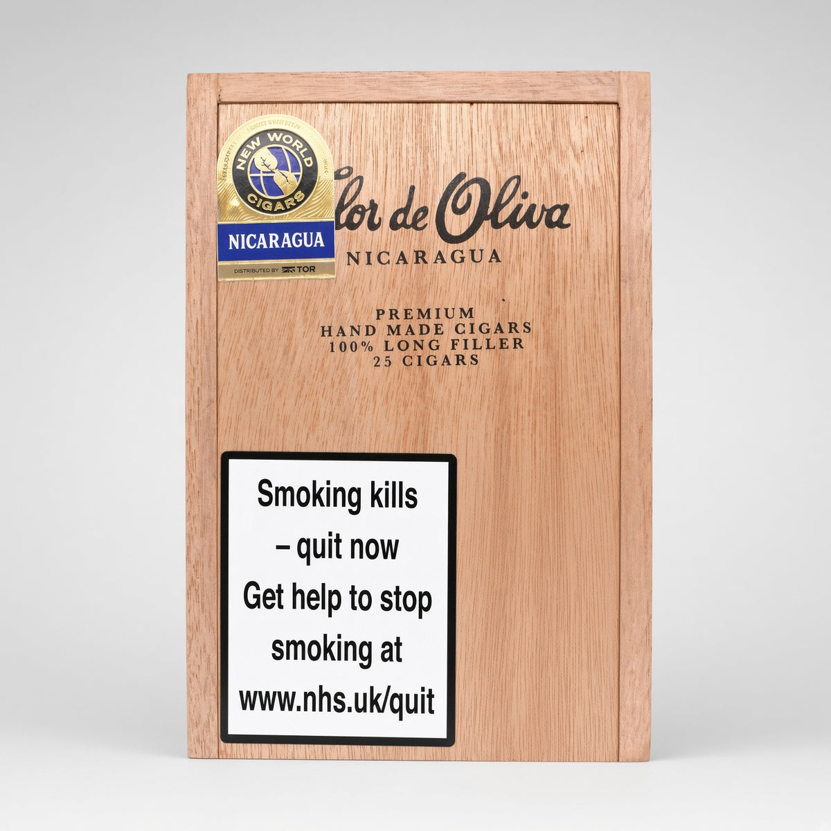 A wooden cigar box for 'lor de Oliva' from Nicaragua, featuring a gold and blue 'Fuego World Cigars' seal, product text, and a prominent white warning label with smoking health text.