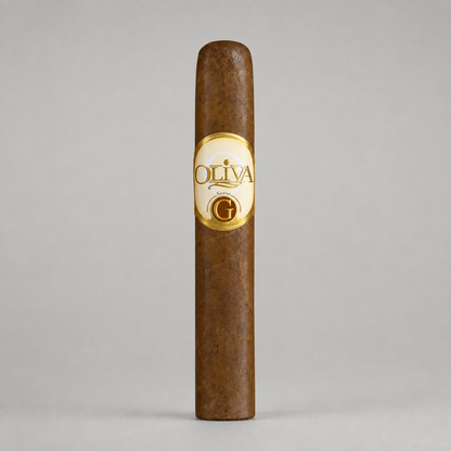 A single brown cigar standing upright against a light gray studio background, featuring a cream and gold oval label with the brand name OLIVA and a large G.