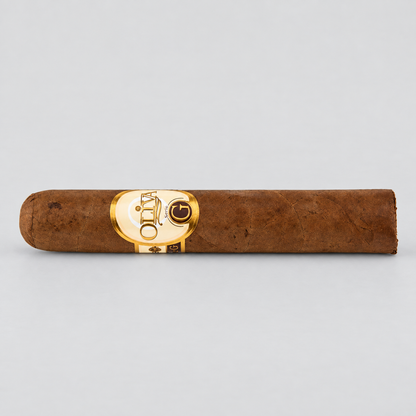 A single brown cigar with a prominent gold oval band featuring the 'Oriental' brand name, photographed horizontally against a light gray background.