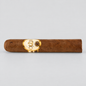 A single brown cigar with a prominent gold oval band featuring the 'Oriental' brand name, photographed horizontally against a light gray background.