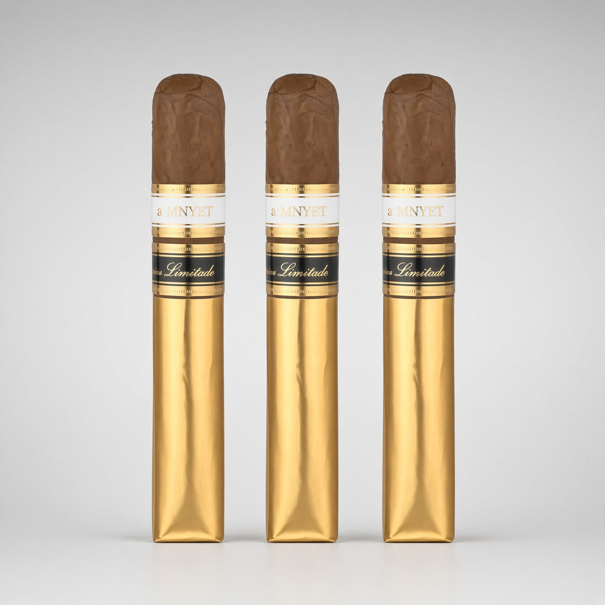 Three gold cigar wrappers standing upright side by side, each topped with a brown cigar tip and a white-and-gold label reading CAVALLINI.