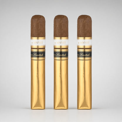 Three gold cigar wrappers standing upright side by side, each topped with a brown cigar tip and a white-and-gold label reading CAVALLINI.