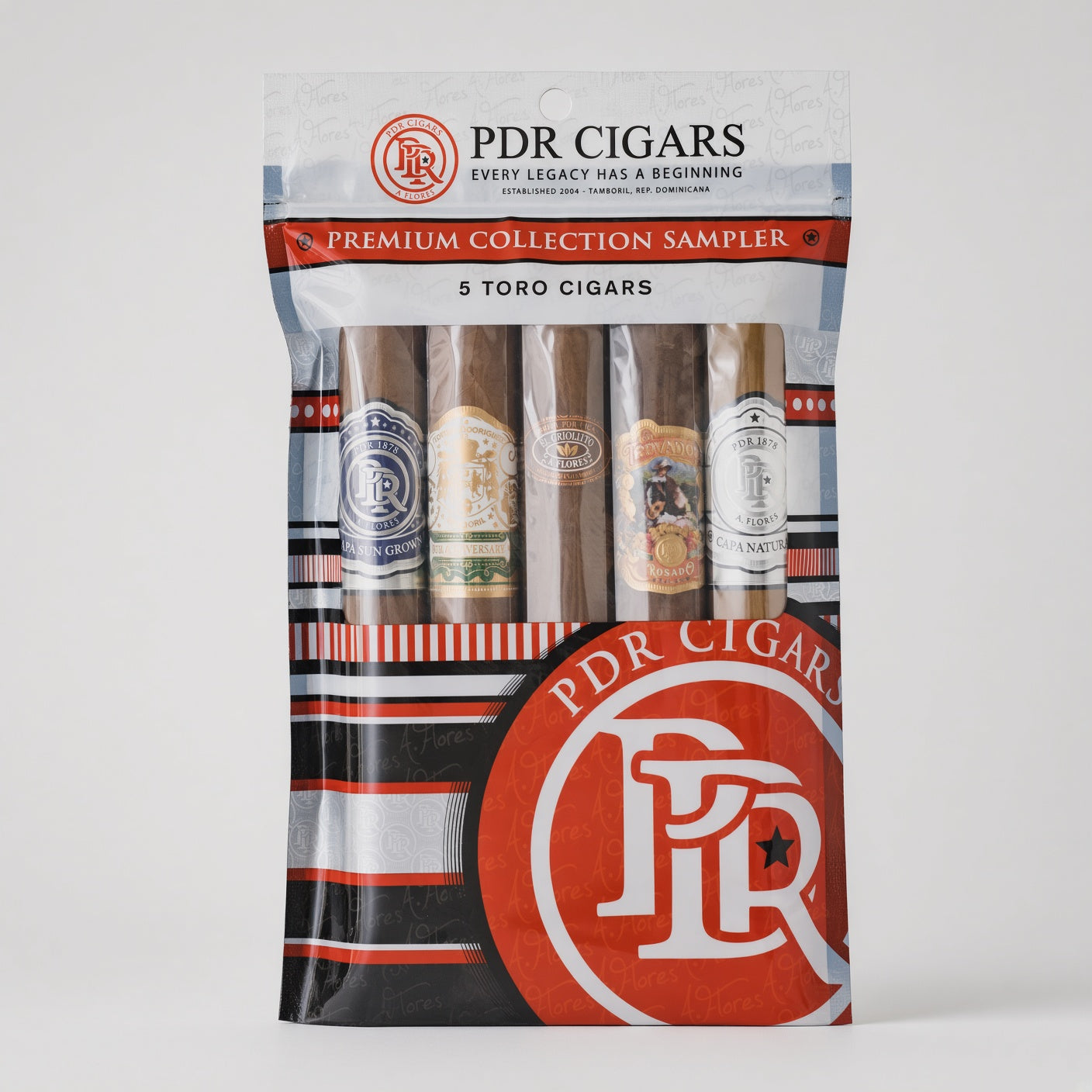PDR Cigars Premium Collection Sampler in a clear plastic pouch with five Toro cigars visible inside, featuring red, white, and black branding on a light gray background.