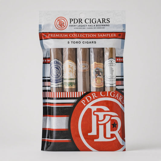 PDR Cigars Premium Collection Sampler in a clear plastic pouch with five Toro cigars visible inside, featuring red, white, and black branding on a light gray background.