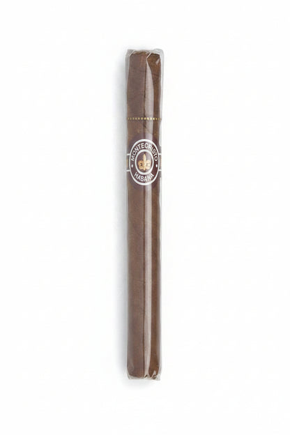 A single Montecristo Haban cigar in its clear plastic wrapper, showing the brown tobacco body and the circular Montecristo logo band.